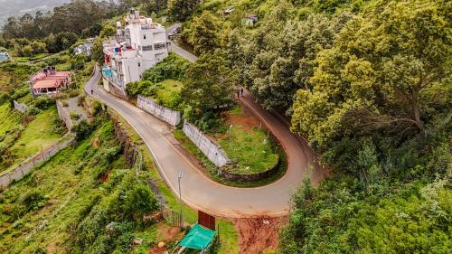 an aerial view of a road next to a house at Le Karaj Meadows in Lovedale
