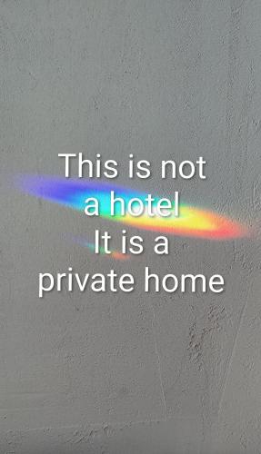 a rainbow in a wall with the words this is not a hotel at Øya husrom-enkeltsenger-kjøkken-bad in Sarpsborg