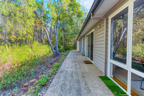 a walkway leading to the side of a house at Kiali 3 Cape Villas Dunsborough in Dunsborough