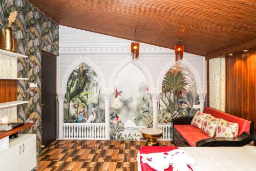 a bedroom with a large mural on the wall at Le Karaj Meadows in Lovedale