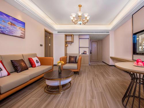 a living room with a couch and a table at Vienna International Hotel Xi'an Jinye Road Branch in Xi'an