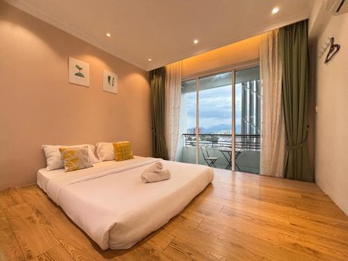 Giường trong phòng chung tại Ipoh Town Majestic Suites by IWH Suites