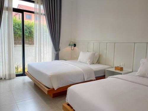 Postel nebo postele na pokoji v ubytování Somatepy Boutique Hotel