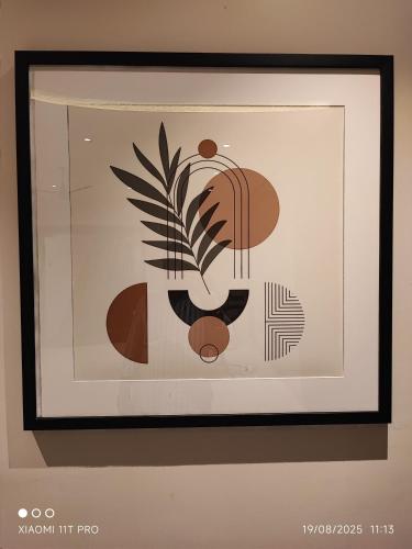 a framed picture of a painting of a plant at hotel raaj castle in Chennai