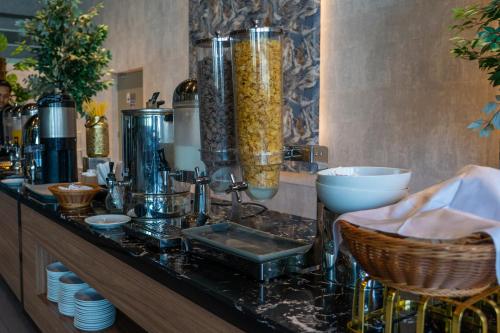 a counter with a bunch of items on it at VOGO Grand Hotel Formerly Best Western Plus Hotel Dubai Academic City in Dubai
