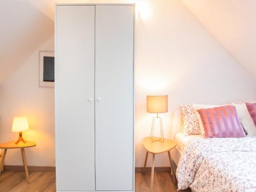 a bedroom with a white closet next to a bed at Holiday home in the centre of Aywaille in Aywaille