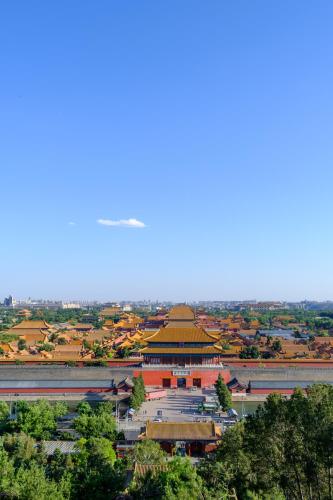a large building with a pagoda in a city at Yinzhuo Hotel - New Chinese decoration, free late-night supplies, free fruit, water and free snacks, close to the International Convention and Exhibition Center, Embassy, Sanlitun, Bird's Nest, close to Sanyuan Bridge of Metro Line 10 and Airport Line in Beijing