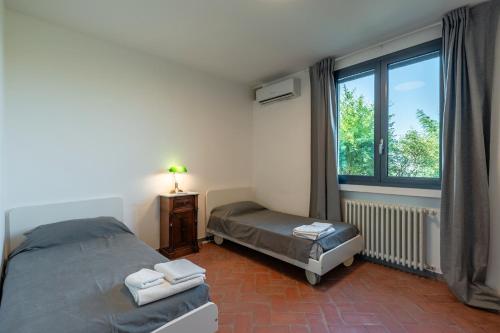 Katil atau katil-katil dalam bilik di Terrazza su San Miniato con garage