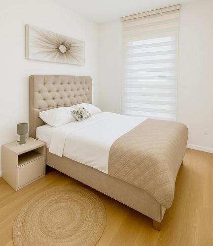 Ένα ή περισσότερα κρεβάτια σε δωμάτιο στο White Homes Apartments • Central Point