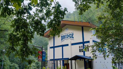 a building with the wordrape on it at The Big Bridge- A Boutique Hotel On A Bridge in Rishīkesh