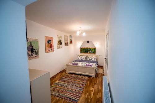 En eller flere senge i et værelse på Mia House Brașov