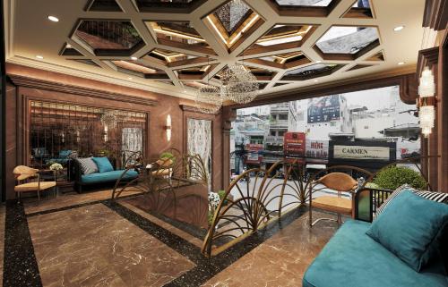 a living room with a coffered ceiling at L'Heritage Premium Hanoi Central in Hanoi