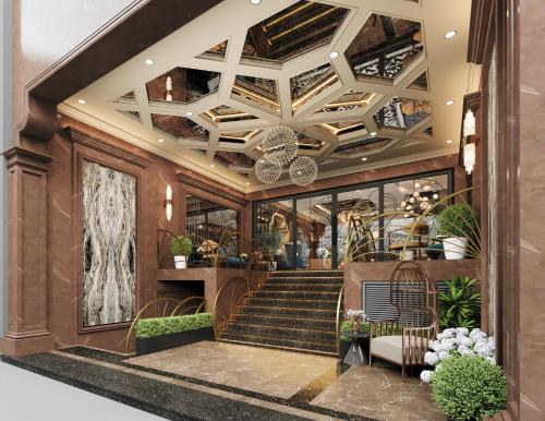 a lobby with a staircase and a chandelier at L'Heritage Premium Hanoi Central in Hanoi