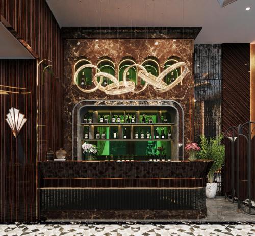 a bar with green bottles on a brick wall at L'Heritage Premium Hanoi Central in Hanoi