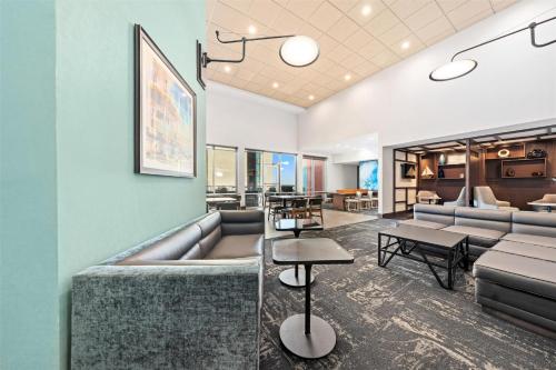 a lobby with couches and tables in a building at Hyatt Place Ocean City Oceanfront in Ocean City
