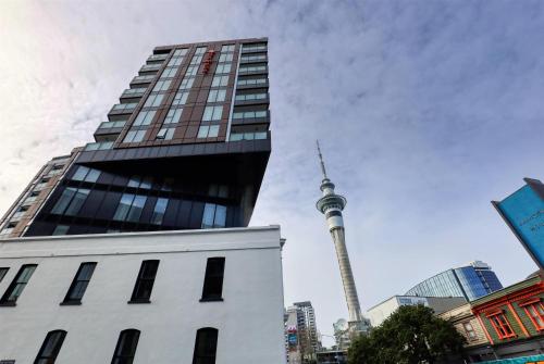 a view of the cn tower in a city at Ramada Suites By Wyndham Victoria Street West in Auckland