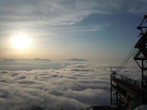 a view of the sun above the clouds at Hotel Tsubakino in Yamanouchi