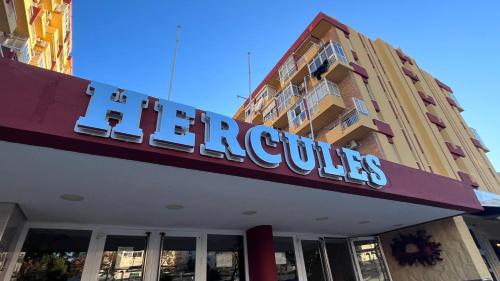 una señal de hospital en la parte delantera de un edificio en Coastal Feeling Loft en Hercules con vista al mar, en Benalmádena