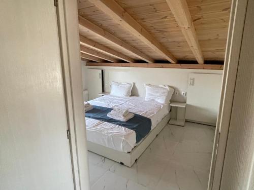 a small bedroom with a bed in a room at Villa Nikiti View in Nikiti