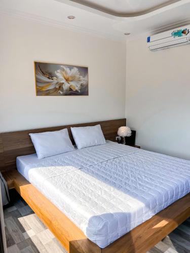 Кровать или кровати в номере Bazan Home Mộc Châu