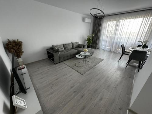 a living room with a couch and a table at Great View & Parking - Harmony Premium Residence in Timişoara