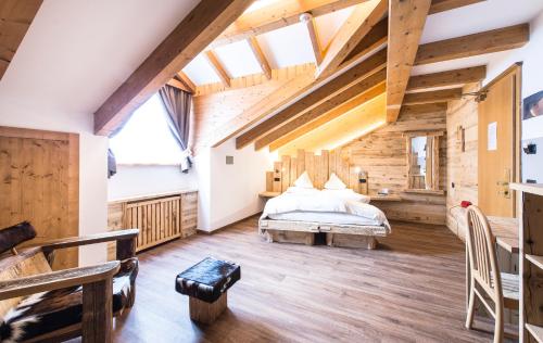 Postel nebo postele na pokoji v ubytování Alpstyle Hotel Albolina Wellness & Beauty