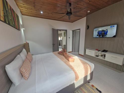 Кровать или кровати в номере Le Tropique Villa