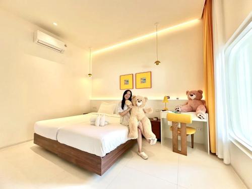 Ένα ή περισσότερα κρεβάτια σε δωμάτιο στο Pattaya Interstellar Village Resort House