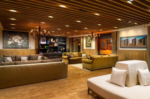 a large living room with couches and chairs in a room at Hotel Caeli in Eceabat