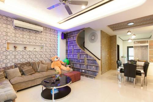 a living room with a couch and a table at Candy House in Wujie