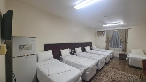 Voodi või voodid majutusasutuse فندق رحاب الجنادرية toas