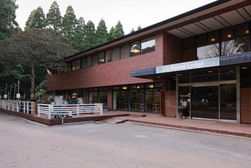 a building with a fence in front of it at Showa Forest Village in Chiba