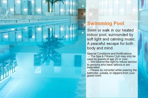 a swimming pool with a sign that reads swimming pool swim or walk in our treated at The Prince Park Tower Tokyo - Preferred Hotels & Resorts, LVX Collection in Tokyo