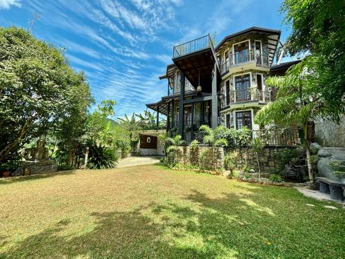 a large house with a yard in front of it at Winterfell Bandarawela in Bandarawela