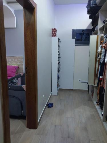 a hallway with a door leading to a room with a couch at House for rent in Malabo - Equatorial Guinea in Ciudad de Malabo