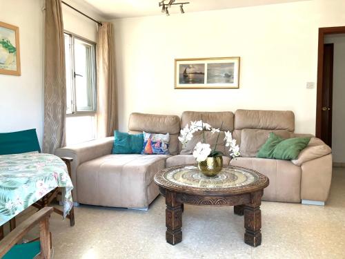a living room with a couch and a table at Admirals Suite, Gibraltar in Gibraltar