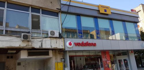 a building with a vodience sign on the side of it at Magic Studio in Ploieşti