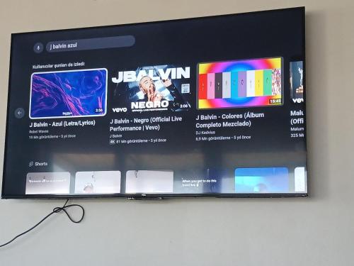 a flat screen tv on a wall at Relax home in Ao Nang 