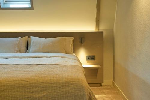 Кровать или кровати в номере Boutique Hotel AEST Terschelling