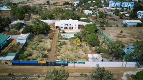 an aerial view of a city with a building and a train at Villa SAIDIA climatisée avec PISCINE in Diego Suarez