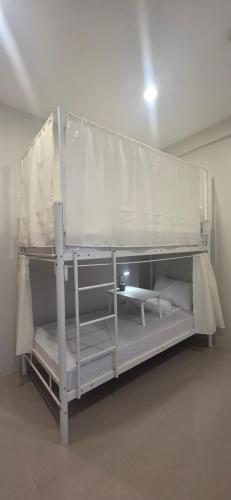 a couple of bunk beds in a room at Cozypod Rentals in Sagcahan