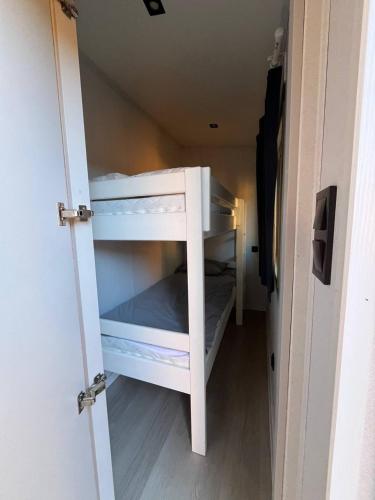 a white bunk bed in a small room at Sopot 34 przy plaży in Sopot