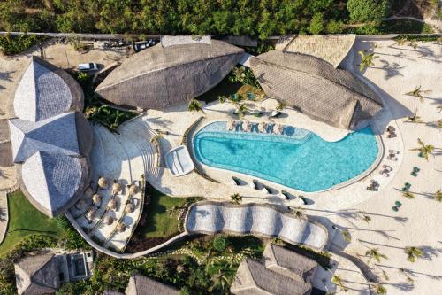an aerial view of a resort with a swimming pool at ARYA Sumba Resort - Kodi in Tambolaka