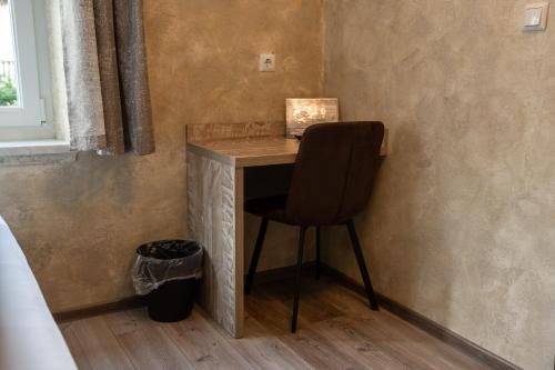 a chair sitting at a desk in a room at Haus Kärnten in Döbriach