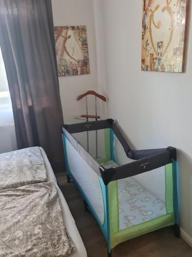 a bedroom with a bunk bed and a crib at Traumoase in Timmendorfer Strand in Timmendorfer Strand
