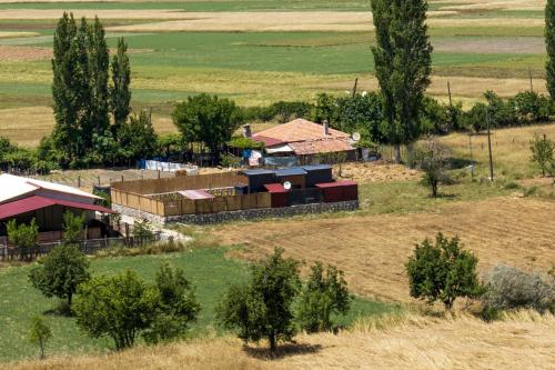 an aerial view of a farm with trees and buildings at Calm and peaceful vacation in Kas, Antalya in Kas