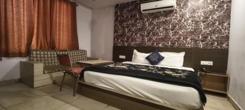 Ένα ή περισσότερα κρεβάτια σε δωμάτιο στο Hotel Neelambar Villa