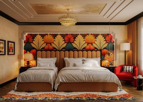 a bedroom with two beds and a painting on the wall at L'Heritage Premium Hanoi Central in Hanoi