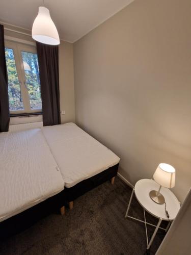 Ένα ή περισσότερα κρεβάτια σε δωμάτιο στο Home Inn ARTK 21-23
