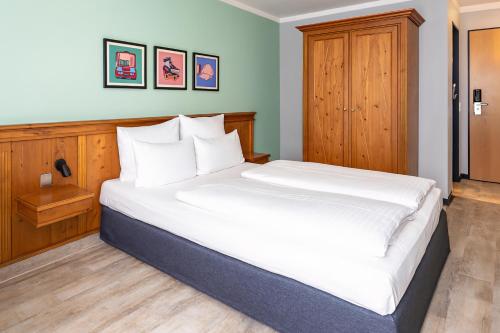 Cama o camas de una habitación en Garner Hotel Munich - Messe by IHG